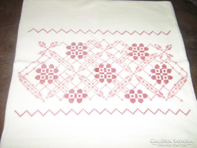 Woven decorative pillow with beautiful cross-stitch