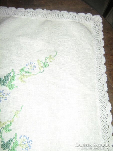 Beautiful hand-embroidered woven tablecloth with lacy edges