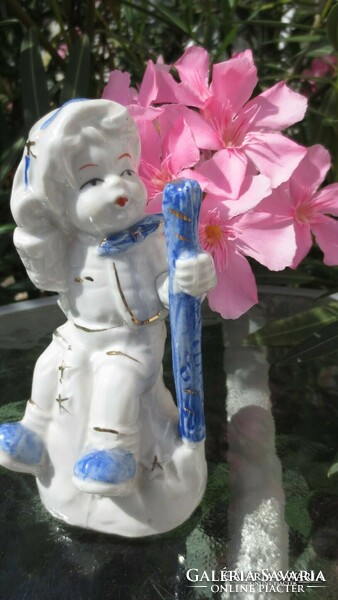Blue and white boy figure