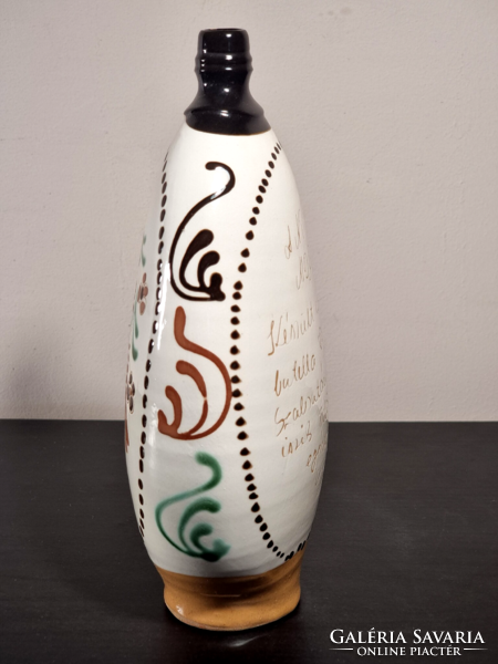 Glazed bottle with Mezőcsát painting with bird inscription dated 1981.