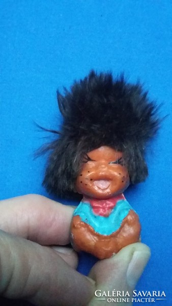 Old laughing big haired tiny rubber doll pencil tip