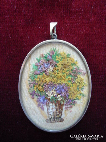 Antique pendant, lockwork, dried flowers in a vase.