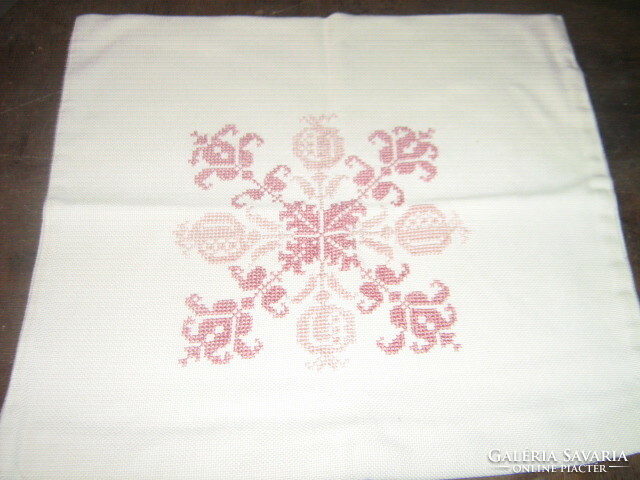 Woven decorative pillow with beautiful cross-stitch