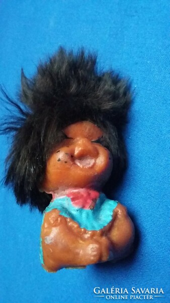 Old laughing big haired tiny rubber doll pencil tip