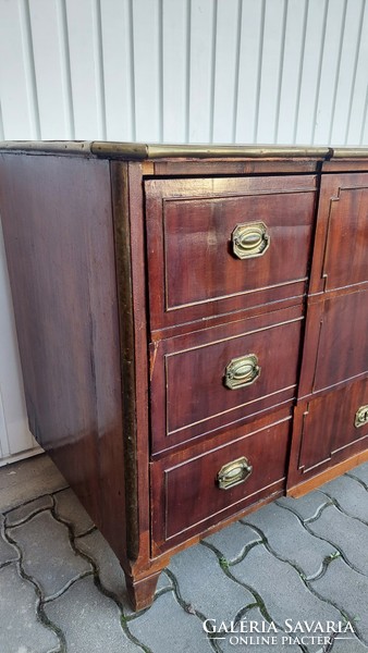 A 200-year-old chest of drawers with copper fittings