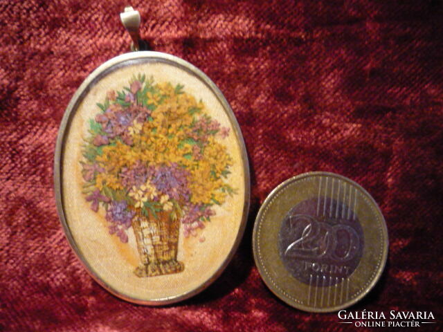 Antique pendant, lockwork, dried flowers in a vase.