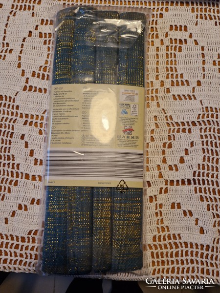 Placemats for the festive table in shiny, Indian, unopened packaging