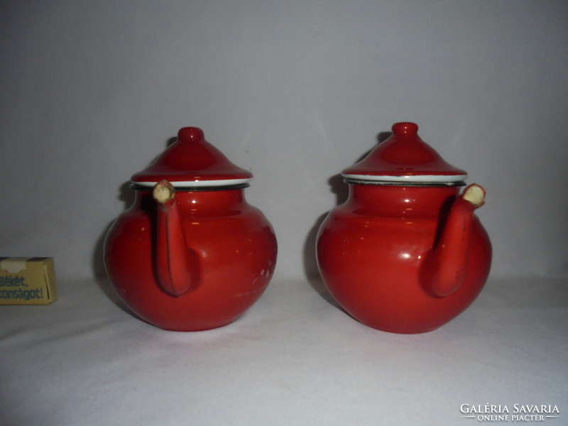 Two red, enamel, spouted, spherical coffee pourers and warming jugs - together