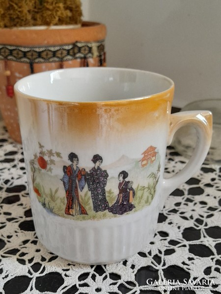 Zsolnay shield seal mug with luster glaze japonizing skirt, cosmetic flaw