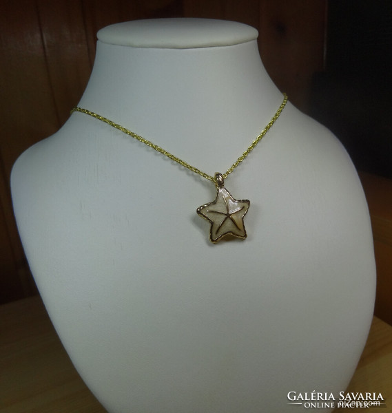Fire enamel gold-colored starfish pendant necklace with incised chain links.