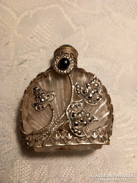 Antique perfume bottle with metal overlay