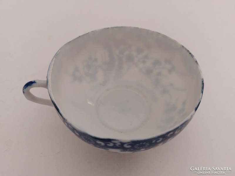 Old Japanese porcelain blue and white tea cup with cherry blossoms