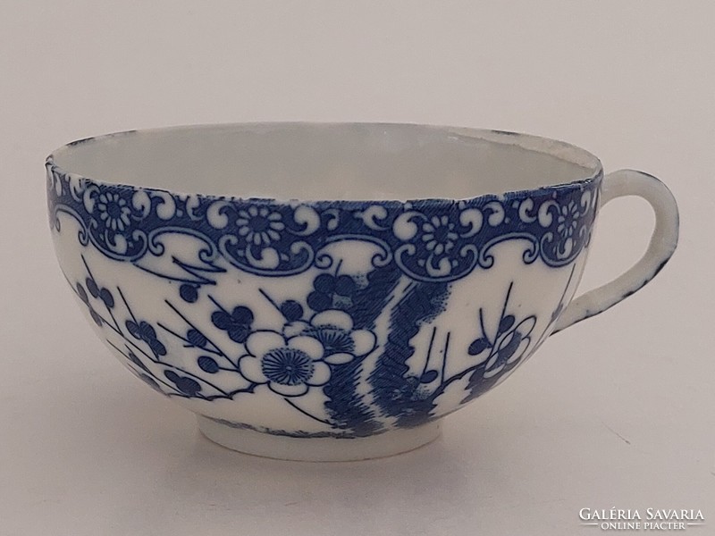 Old Japanese porcelain blue and white tea cup with cherry blossoms