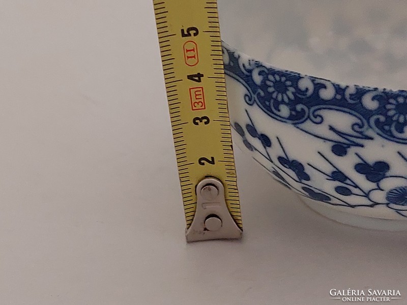 Old Japanese porcelain blue and white tea cup with cherry blossoms