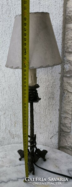 Antique bronze table lamp with lion sculptures. - Candle holder with ram's heads