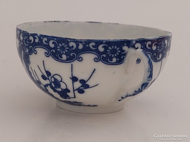 Old Japanese porcelain blue and white tea cup with cherry blossoms