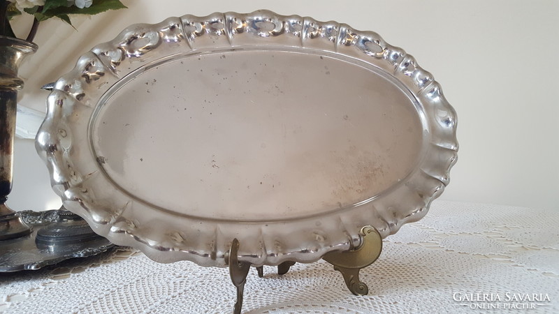 Old metal tray with blistered edge, marked oval