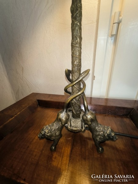 Antique bronze table lamp with lion sculptures. - Candle holder with ram's heads
