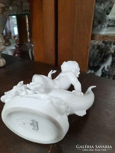 German, Germany Rosenthal putto sitting on a fish, child figural sculpture, porcelain figure. G. Opel. 14.5 Cm.