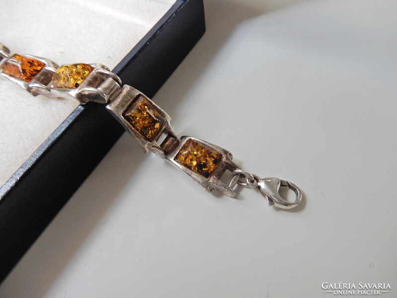 Old silver bracelet with amber stones