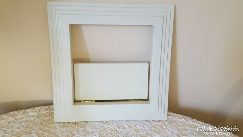 Fold-out shelf with white frame, picture frame 35x35cm.