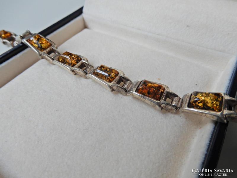 Old silver bracelet with amber stones