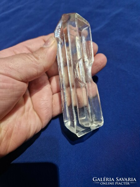 Glass toothpick holder with tooth trough.