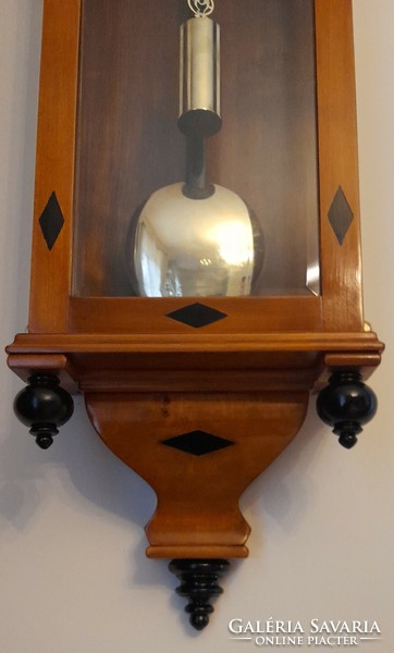 Biedermeier wall clock with inlaid ebony inlay and secret compartment