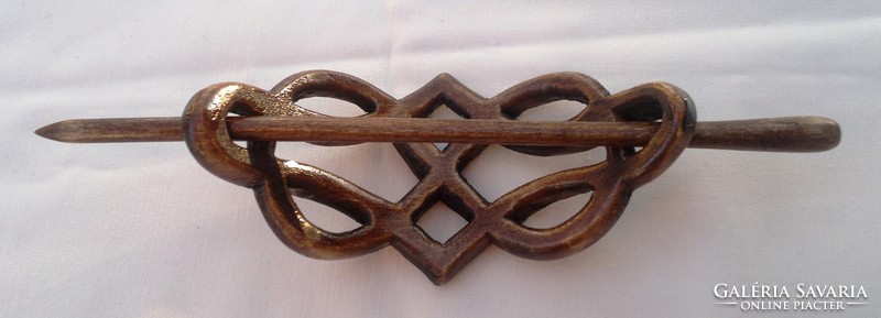 Bun decoration with Celtic motif carved from wood