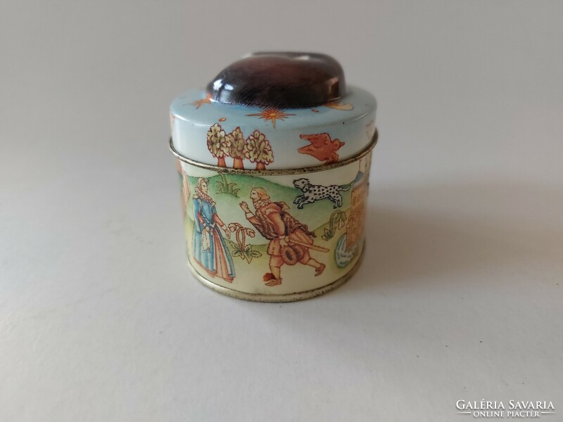 Small metal box with a fairy tale pattern