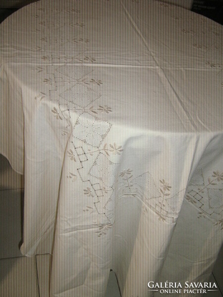 Beautiful hand-embroidered azure pale beige needlework tablecloth