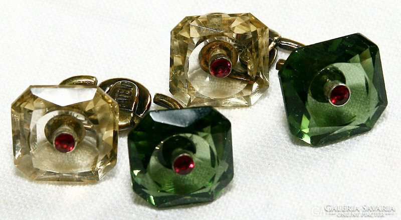 A pair of cufflinks made of antique gold and genuine gemstones decorated with brilliant and ruby gemstones