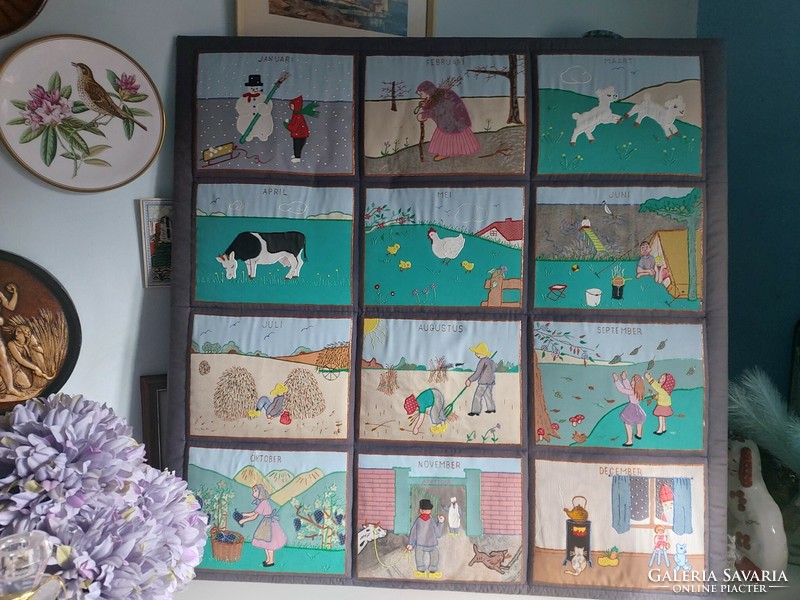 The pictures show the months of the year on a charming, almost 1x1 meter huge needlework board