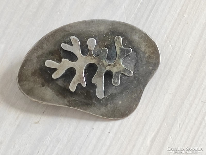 Silver-plated craftsman pin with lichen motif. From the legacy of the 