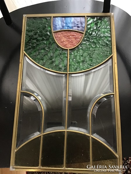 Old polished stained glass with a copper frame