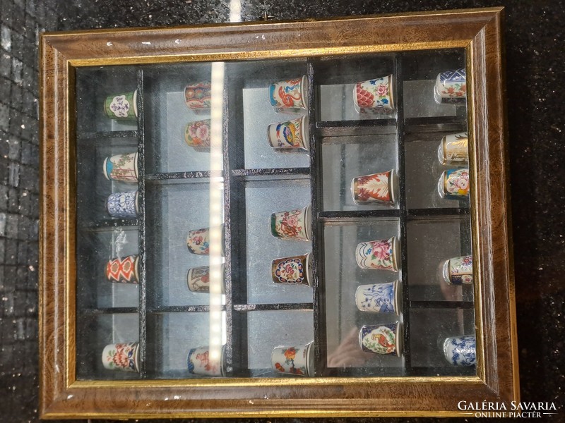 Royal Worcester English porcelain thimble collection in a wooden display case with a mirror insert, a collection of 25 pieces