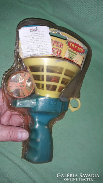 Retro puck-launching toy set in unopened packaging as shown in the pictures