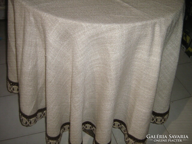 Beautiful lacy-edged oval elegant woven tablecloth
