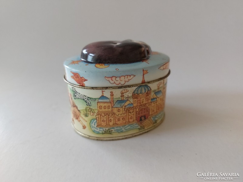 Small metal box with a fairy tale pattern