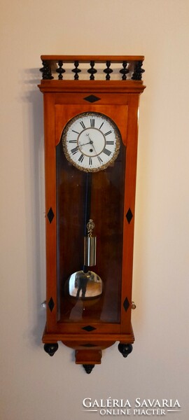 Biedermeier wall clock with inlaid ebony inlay and secret compartment