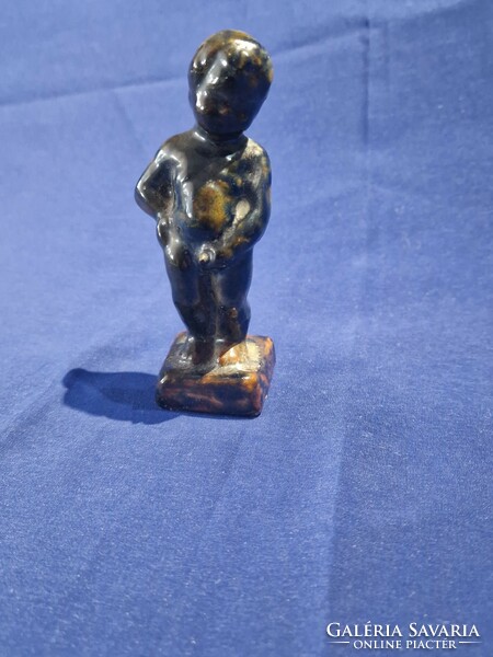 Ceramic dark glazed marked peeing boy figure