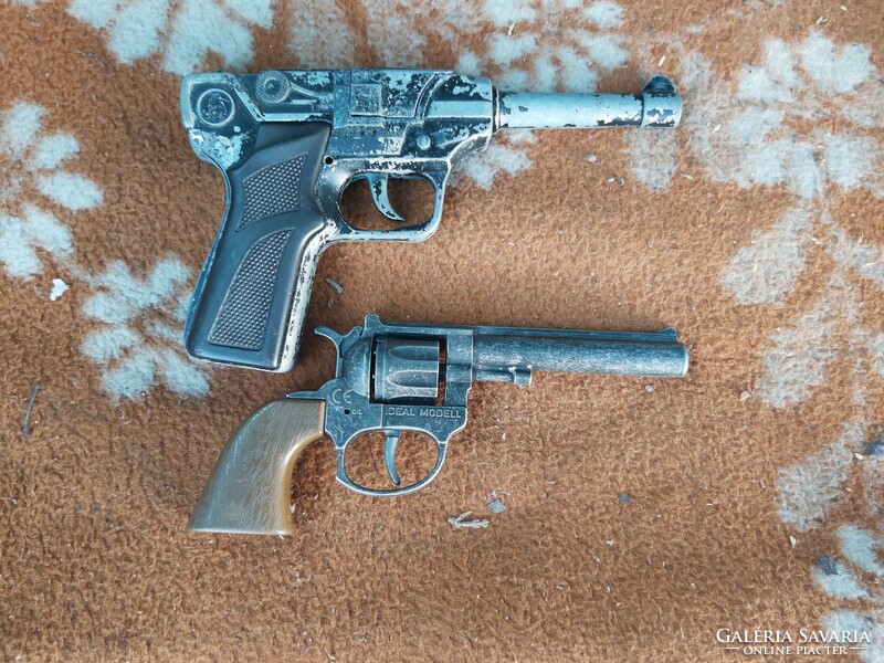 Old cartridge metal toy pistols