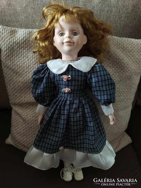 Doll with porcelain limbs