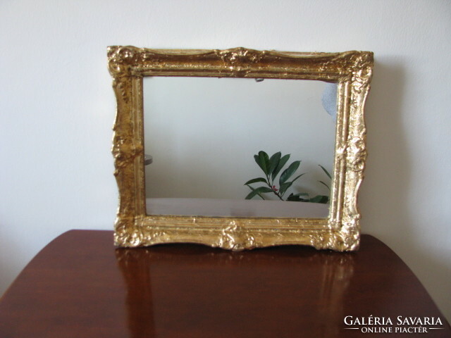 Mirror in gold smoke frame