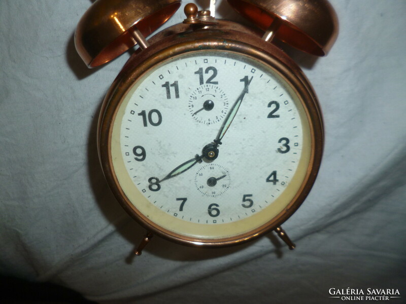 Old copper mechanical alarm clock alarm clock