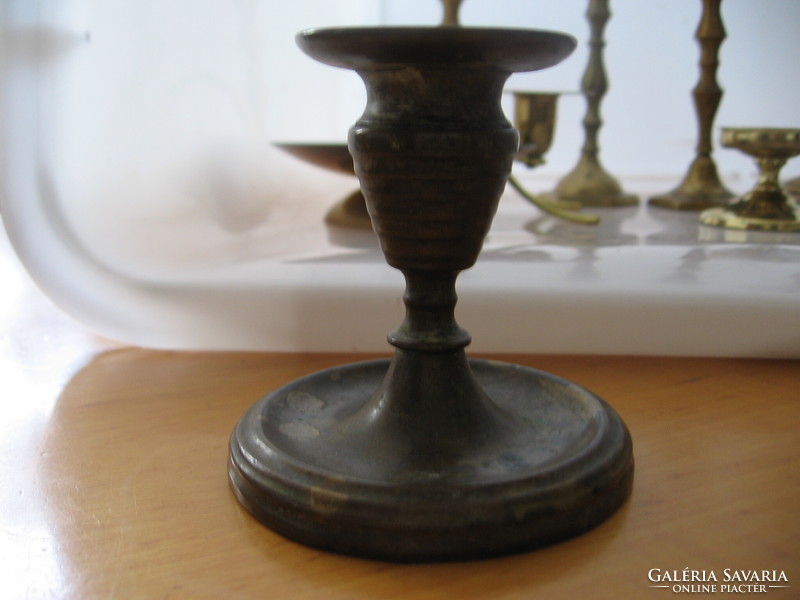 Old copper candle holder with patina