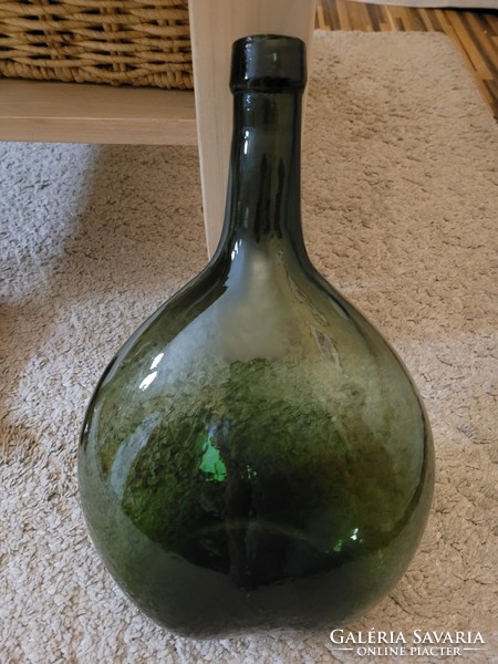Old giant green glass, bottle.
