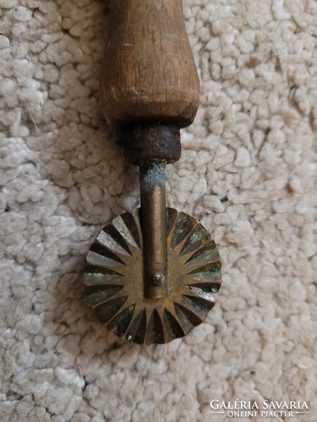 Old brass cutter with copper head.