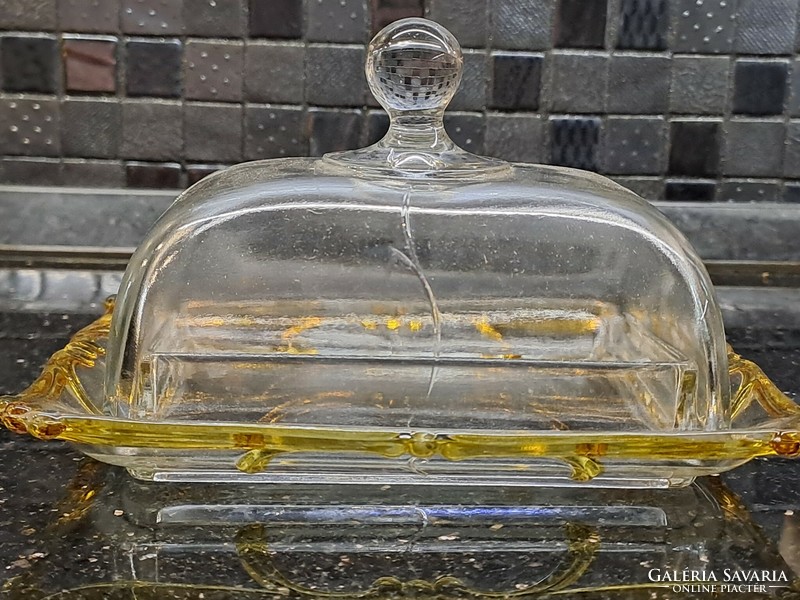 Old glass butter container with an exciting wavy colored edge