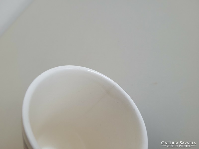 Old granite cup with a tulip pattern